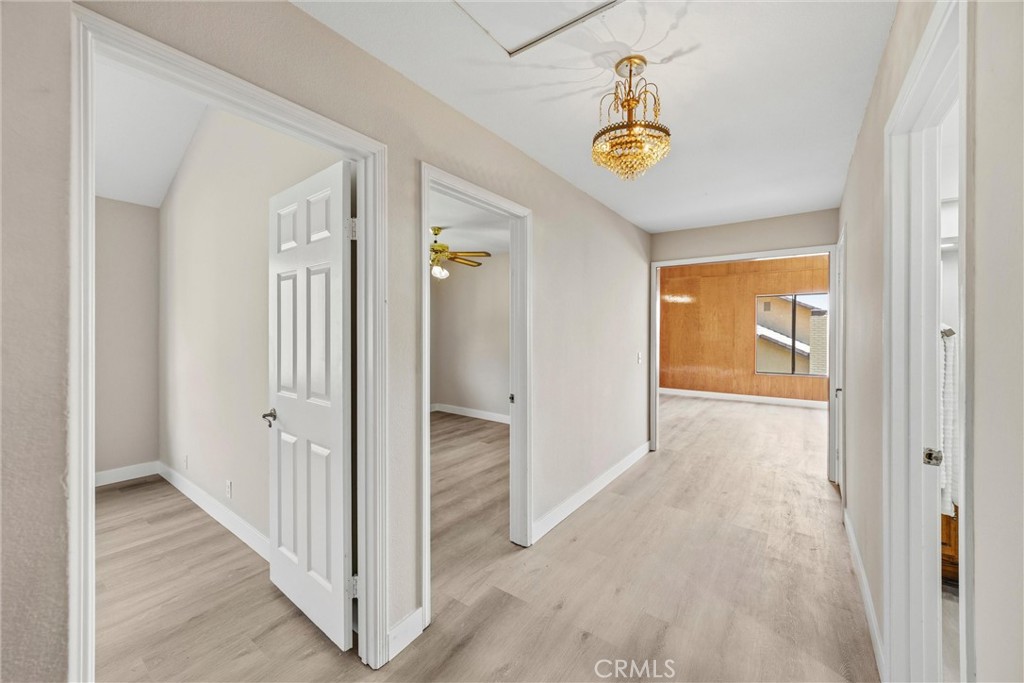 5895 Jadeite Avenue Rancho Cucamonga, CA 91737 - Photo 37 of 71 a view of a hallway view with wooden floor and staircase