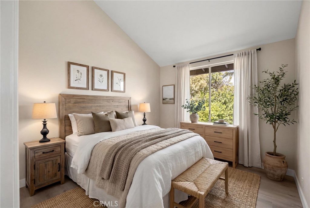 5895 Jadeite Avenue Rancho Cucamonga, CA 91737 - Photo 38 of 71 a bedroom with a large bed and a window