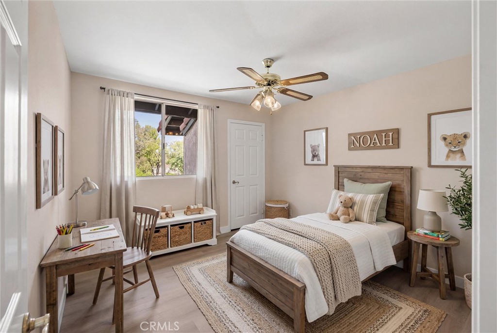5895 Jadeite Avenue Rancho Cucamonga, CA 91737 - Photo 40 of 71 a bedroom with a bed and a chandelier