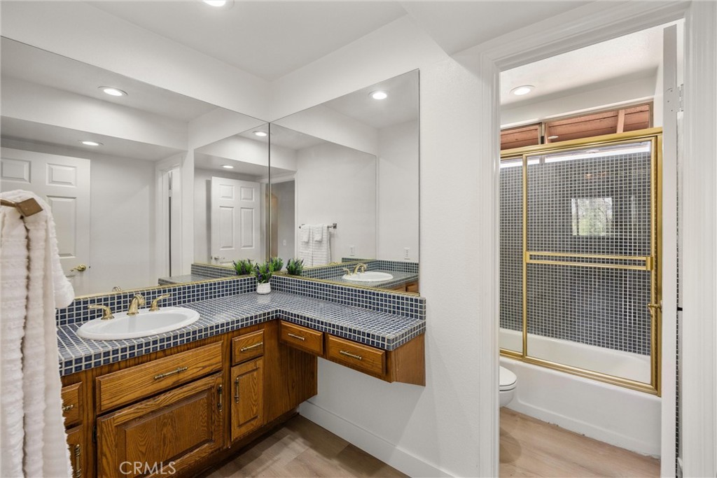 5895 Jadeite Avenue Rancho Cucamonga, CA 91737 - Photo 42 of 71 a spacious bathroom with a granite countertop tub sink and mirror