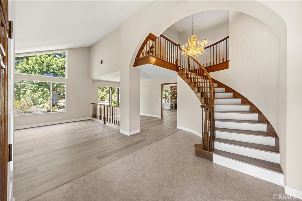 5895 Jadeite Avenue Rancho Cucamonga, CA 91737 - Photo 5 of 71 a view of entryway and hall with wooden floor