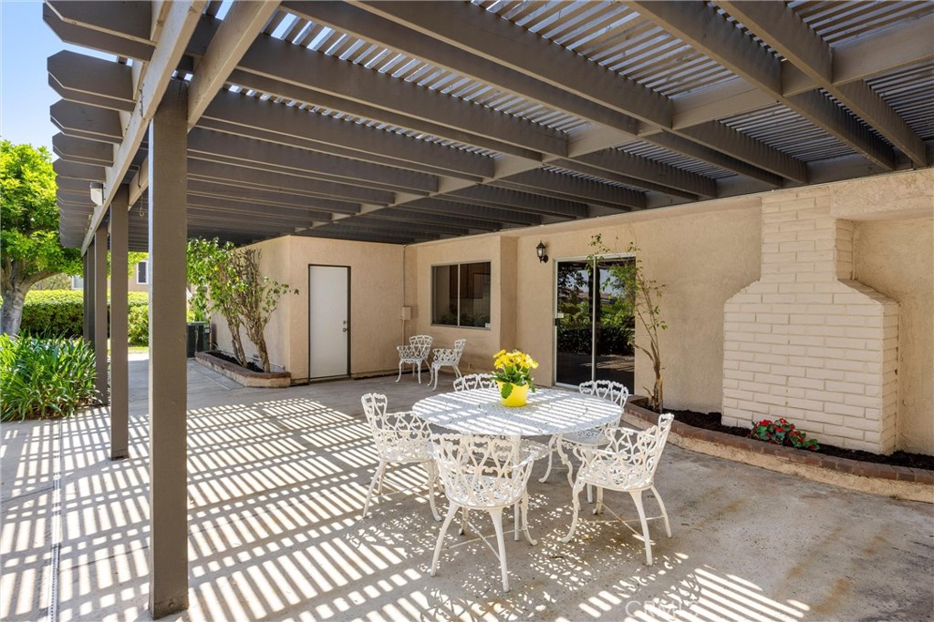 5895 Jadeite Avenue Rancho Cucamonga, CA 91737 - Photo 57 of 71 a patio with a table and chairs and potted plants