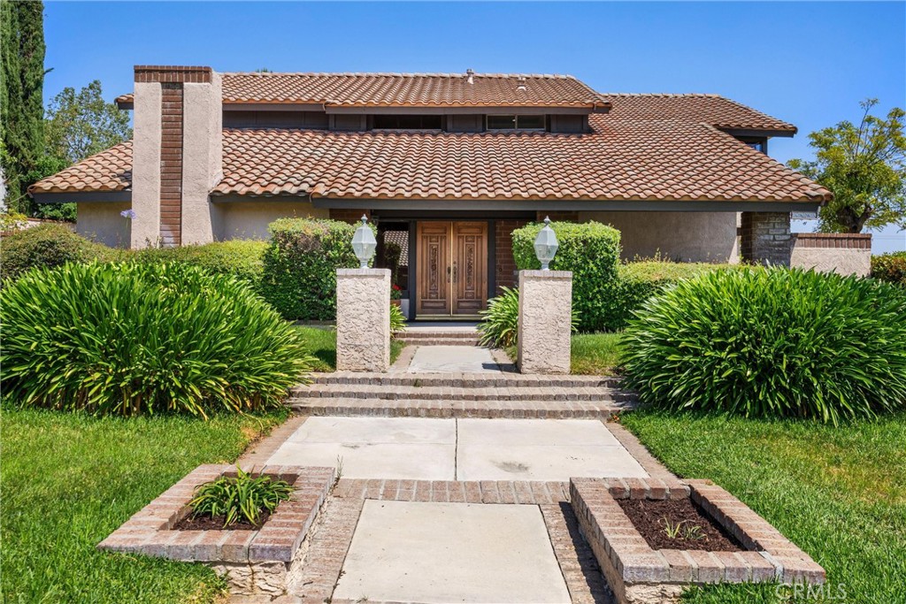 5895 Jadeite Avenue Rancho Cucamonga, CA 91737 - Photo 71 of 71 a front view of a house with garden