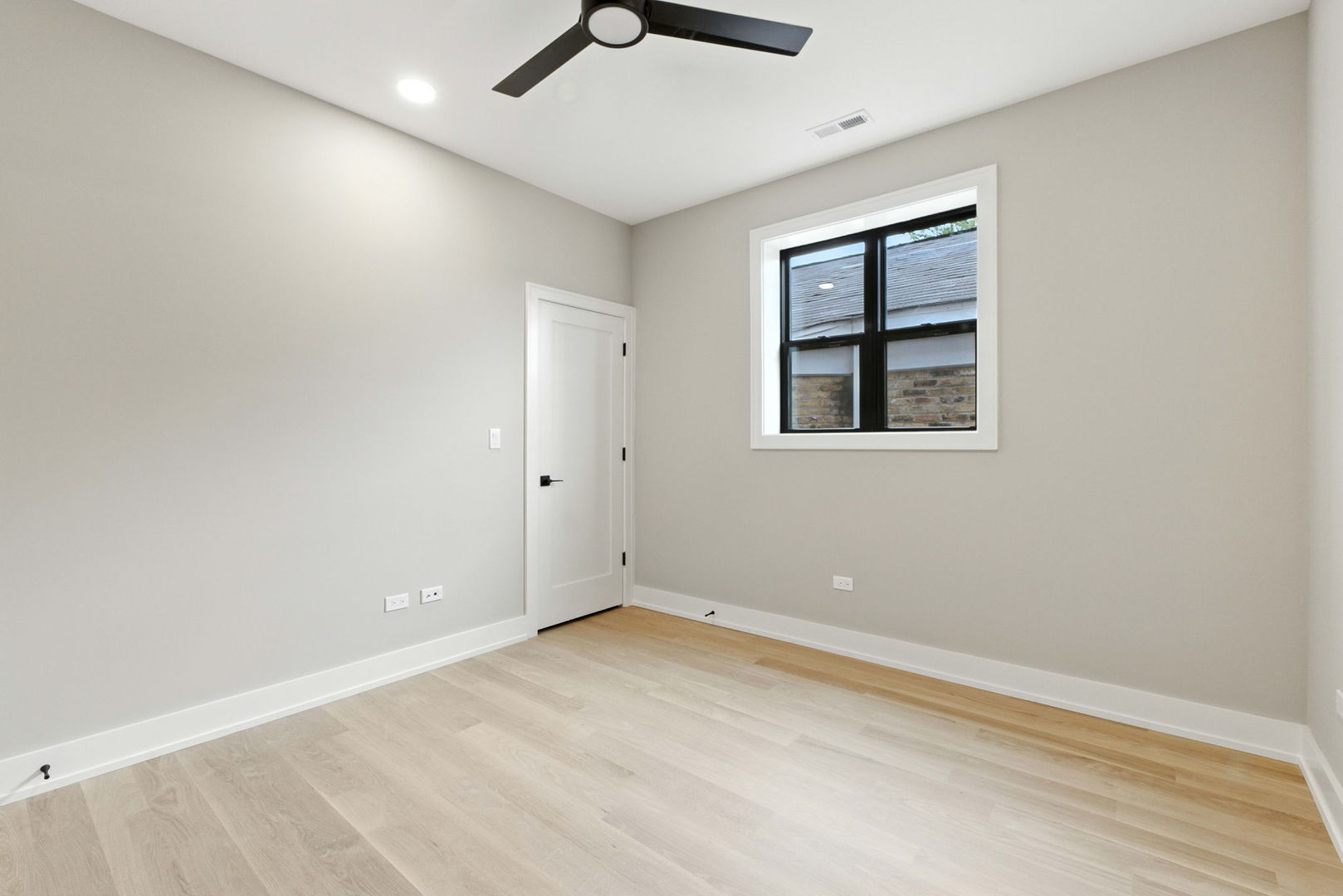 1443 West Roscoe Street, Unit 1 Chicago, IL 60657 - Photo 12 of 15 an empty room with windows and closet