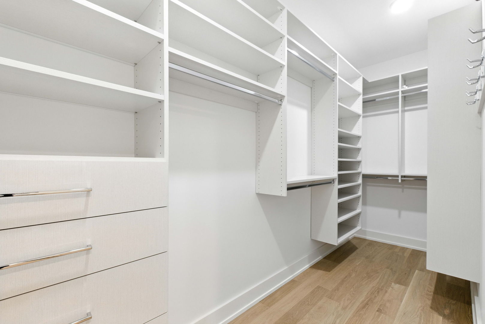 1443 West Roscoe Street, Unit 1 Chicago, IL 60657 - Photo 14 of 15 a view of walk in closet with empty racks