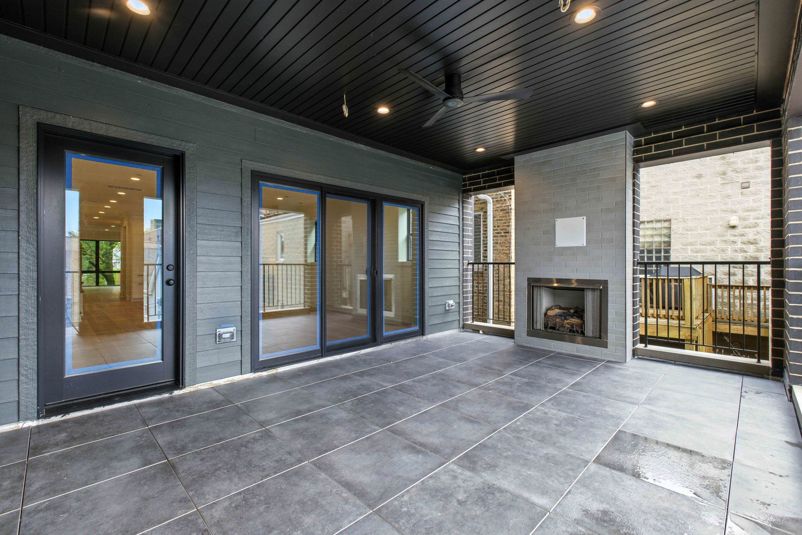1443 West Roscoe Street, Unit 1 Chicago, IL 60657 - Photo 6 of 15 a view of an empty room with a fireplace and a window