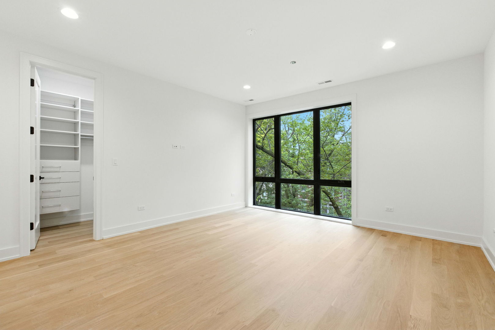 1443 West Roscoe Street, Unit 1 Chicago, IL 60657 - Photo 7 of 15 a view of an empty room with a window