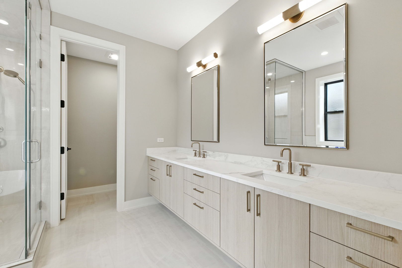 1443 West Roscoe Street, Unit 1 Chicago, IL 60657 - Photo 8 of 15 a bathroom with a double vanity sink mirror and double