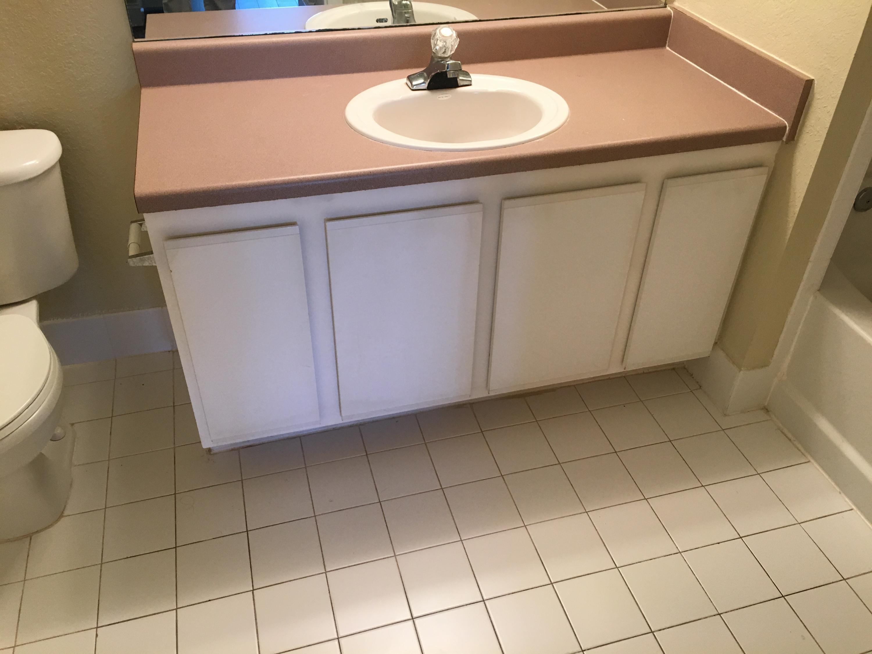 161 Southwest Palm Drive, Unit 205 Port St. Lucie, FL 34986 - Photo 11 of 22 a bathroom with a sink and a toilet