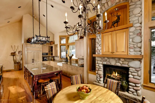 a living room with fireplace furniture and a fireplace