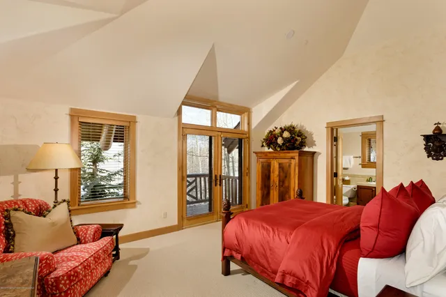 a bed room with a bed and a couch