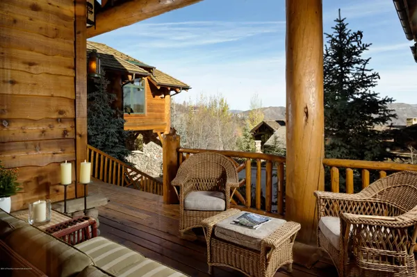 a view of a balcony with chairs