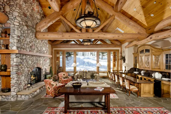 a living room with fireplace furniture and a fireplace