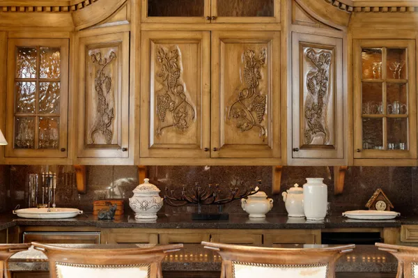 a kitchen with stainless steel appliances granite countertop a stove and cabinets