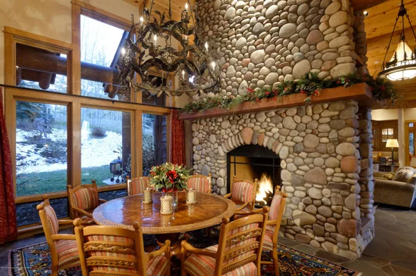 a view of a dining room with furniture window and outside view