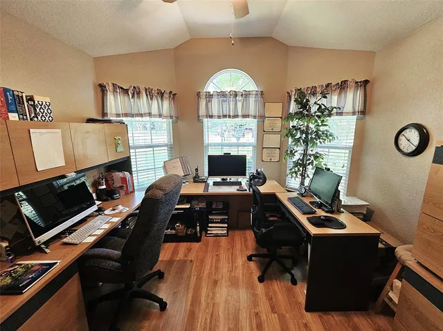 a living room with furniture pool table and a large window