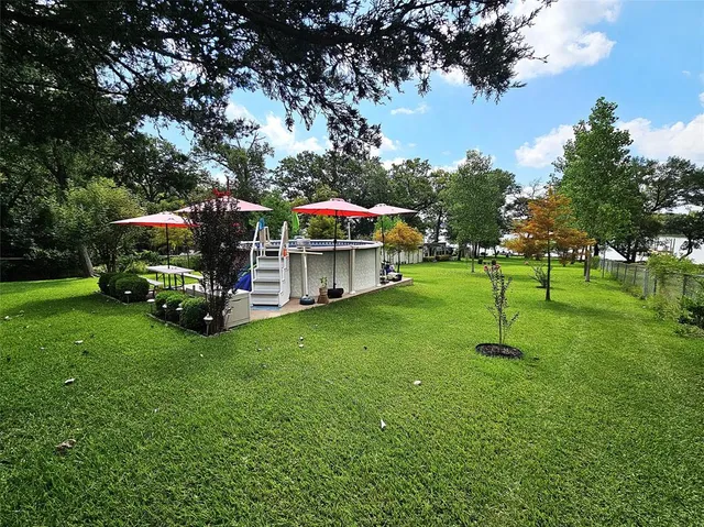 a backyard of a house with lots of green space