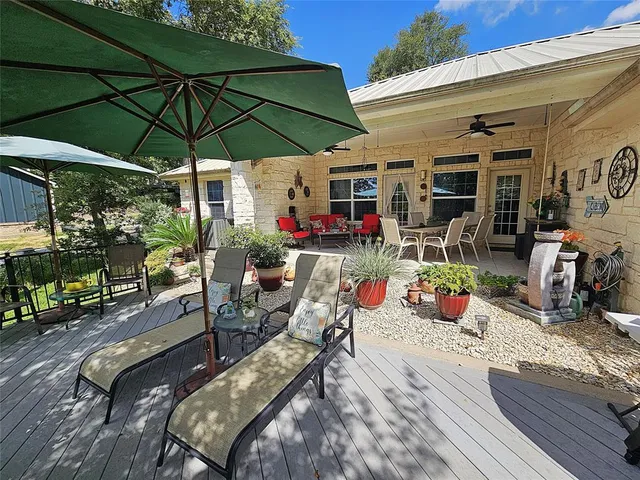 a view of a chairs and table in the patio