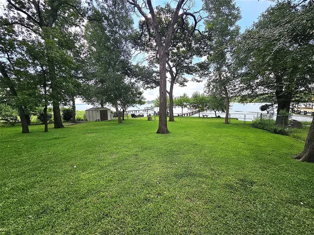 an outdoor sitting area with couch and umbrella