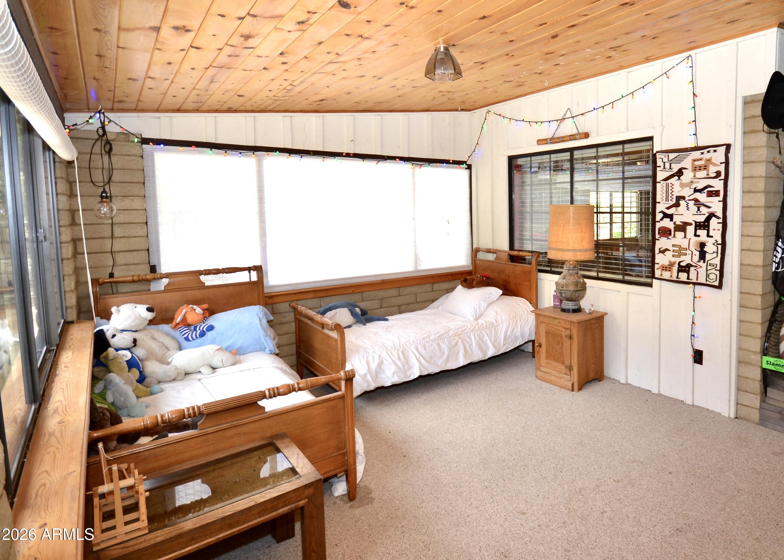 23617 South Demascus Road Crown King, AZ 86343 - Photo 30 of 50 a bedroom with bed and window