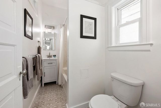 a bathroom with a toilet sink and tub