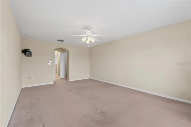 a large kitchen with a sink and cabinets