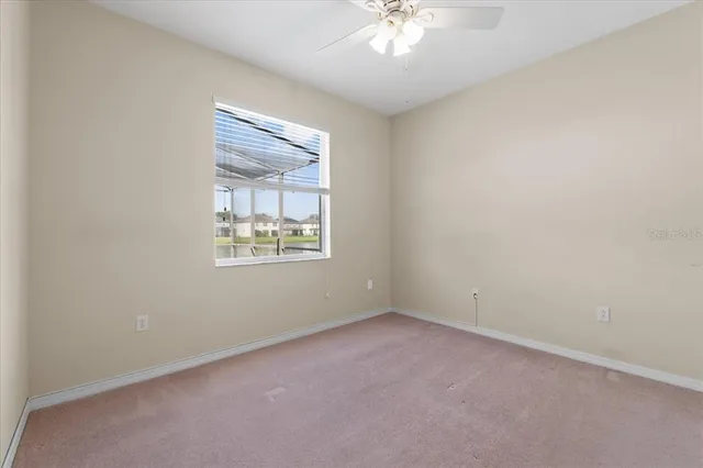 a bathroom with a toilet and a bath tub