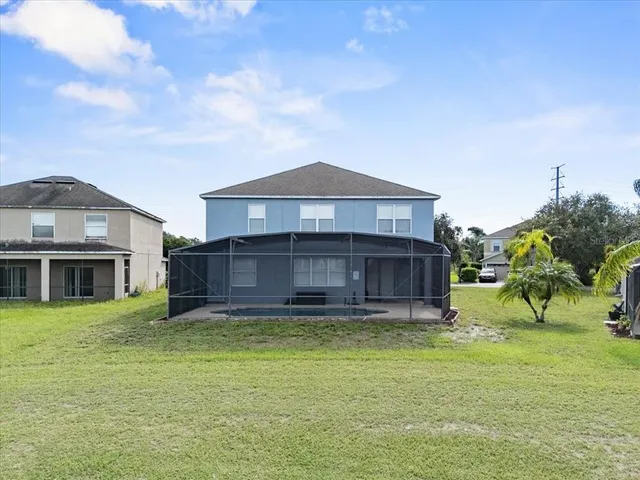 an aerial view of a house with a lake view