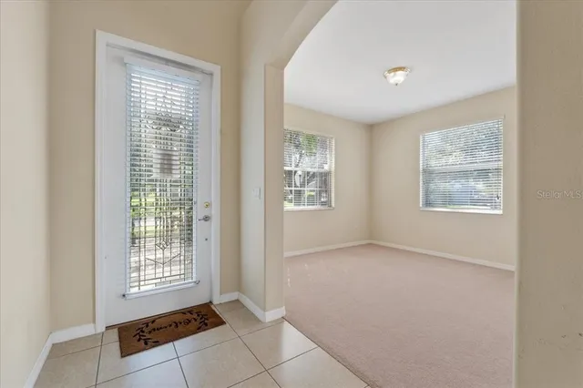 a view of an empty room with a fireplace
