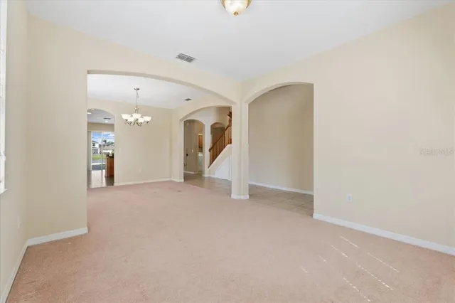 a view of a big room with closet and windows