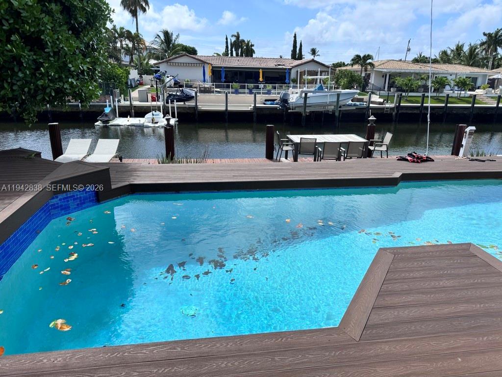 4130 Northeast 23rd Avenue Lighthouse Point, FL 33064 - Photo 18 of 20 a view of a swimming pool with seating area