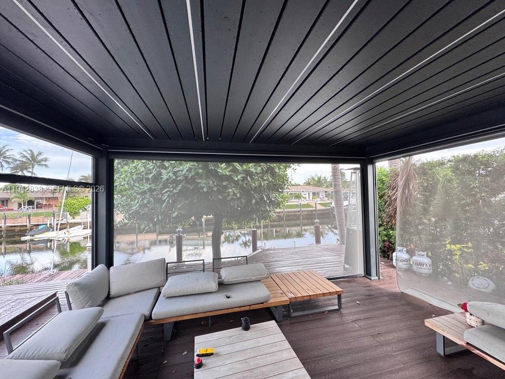 4130 Northeast 23rd Avenue Lighthouse Point, FL 33064 - Photo 19 of 20 a living room with furniture and a large window