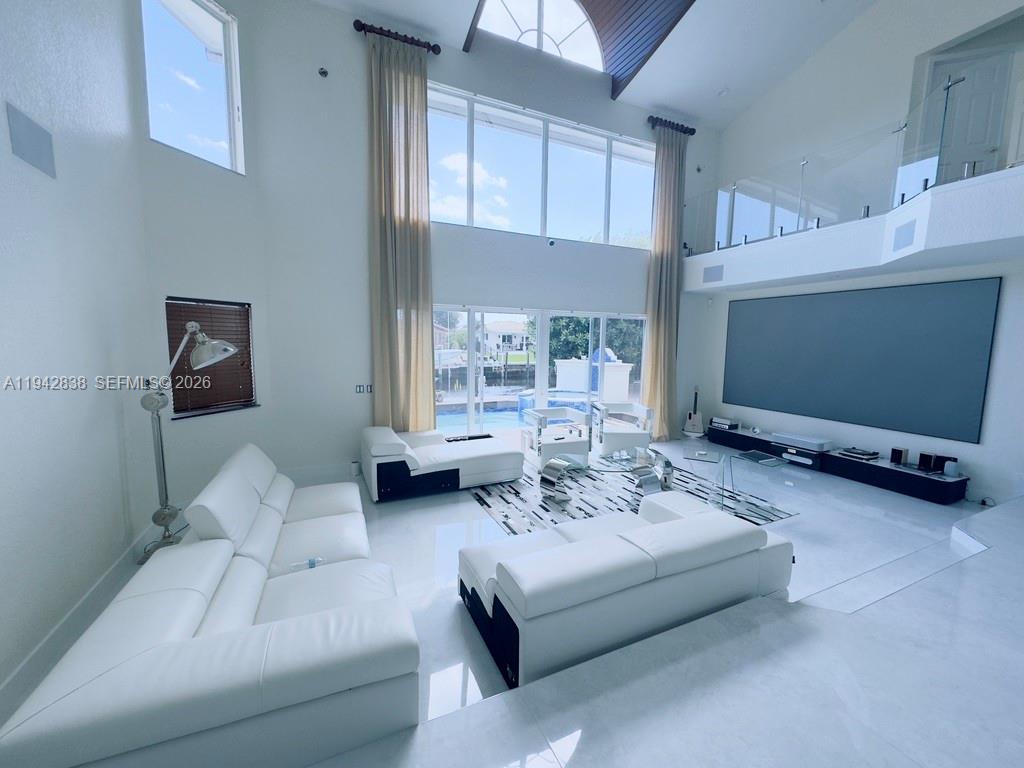 4130 Northeast 23rd Avenue Lighthouse Point, FL 33064 - Photo 4 of 20 a living room with furniture and a flat screen tv