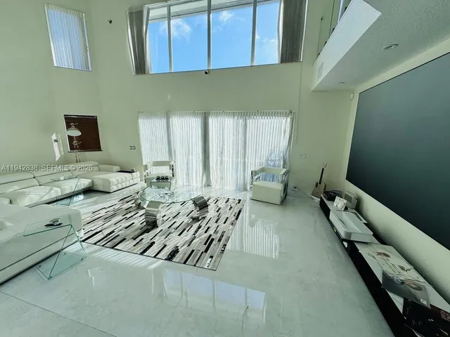 a view of a bedroom with furniture