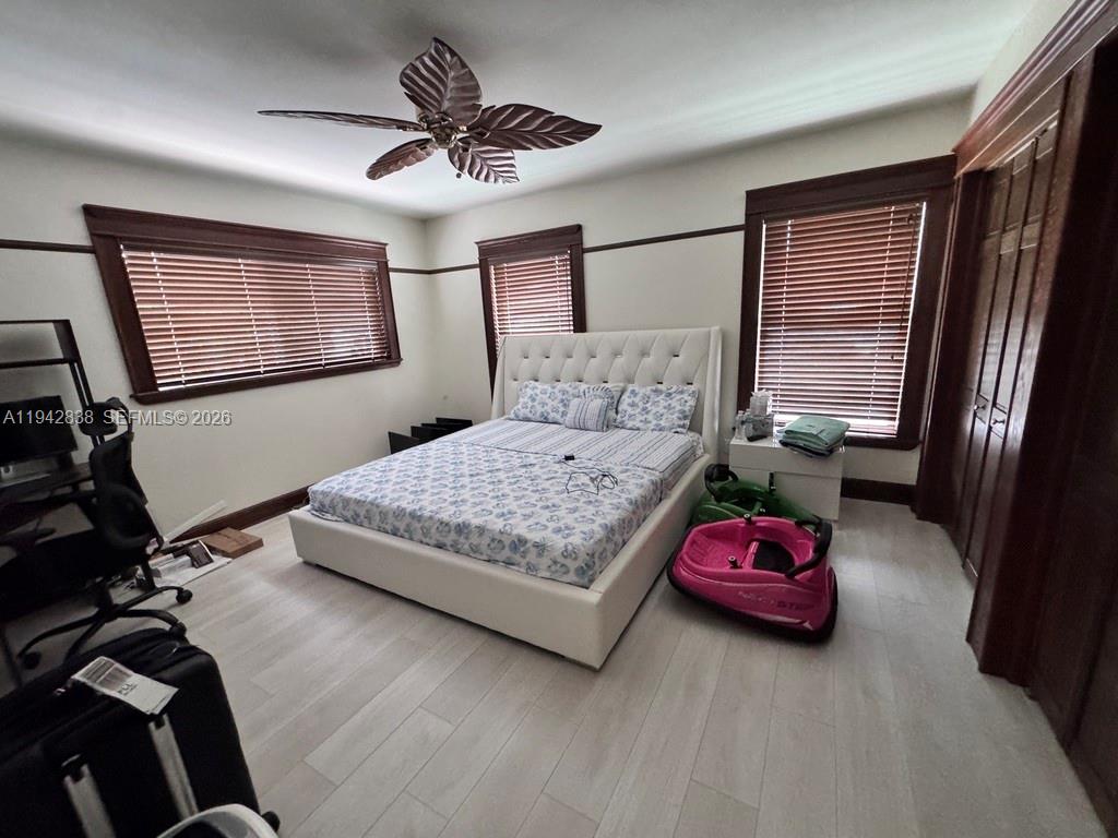 4130 Northeast 23rd Avenue Lighthouse Point, FL 33064 - Photo 8 of 20 a bedroom with a bed dresser and window