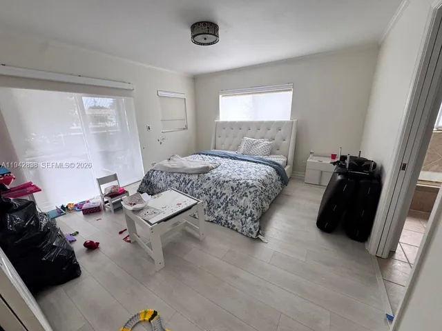 a bedroom with a bed and a dresser