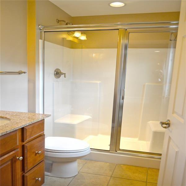 317 Maple Ridge Drive Canonsburg, PA 15317 - Photo 11 of 20 a bathroom with a granite countertop shower a toilet and a sink