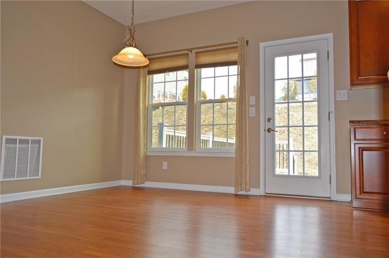 317 Maple Ridge Drive Canonsburg, PA 15317 - Photo 5 of 20 a view of an empty room with wooden floor and a window