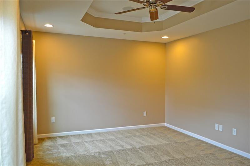 317 Maple Ridge Drive Canonsburg, PA 15317 - Photo 7 of 20 en empty room with a ceiling fan and carpet