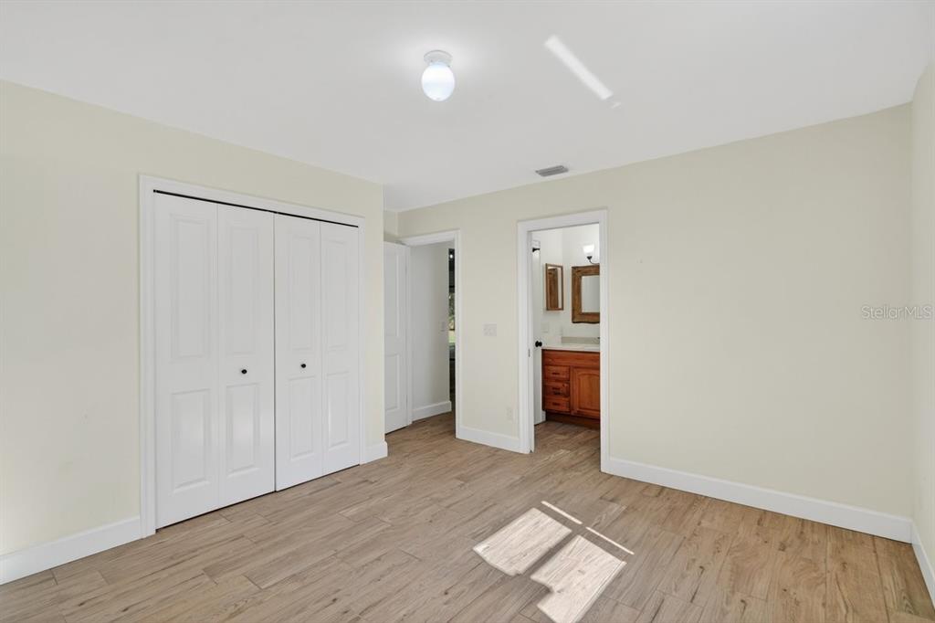 171 William Street Edgewater, FL 32141 - Photo 14 of 40 an empty room with wooden floor and windows