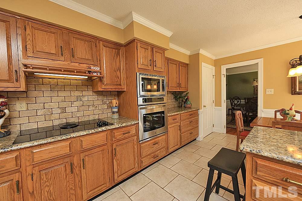 9401 South Mere Court Raleigh, NC 27615 - Photo 12 of 30 Granite counters. Tile floors.