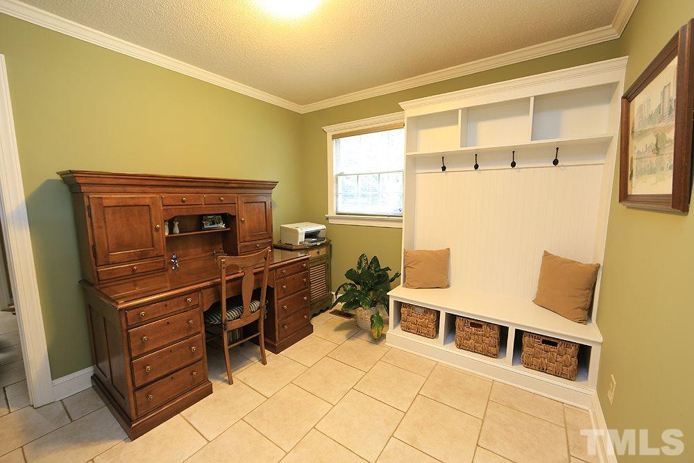 9401 South Mere Court Raleigh, NC 27615 - Photo 14 of 30 Built in storage for coats/shoes as you enter from garage.