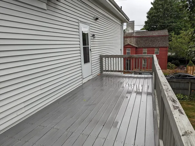 a view of wooden balcony with a sink