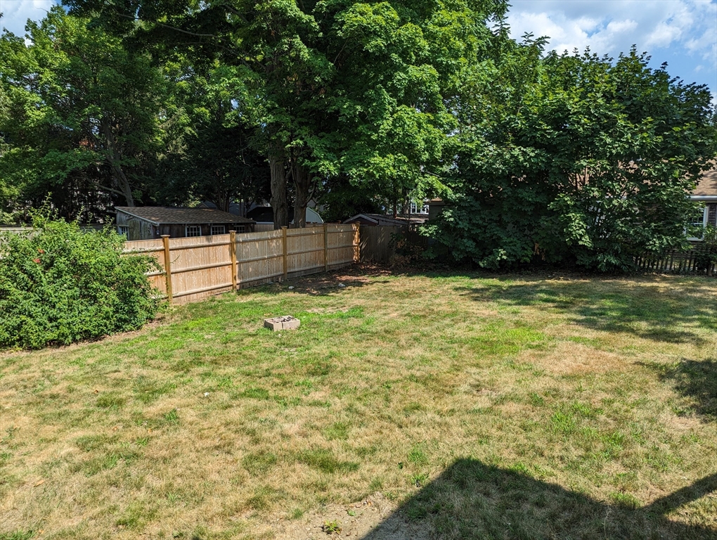 33 Merrill Street, Unit 3 Newburyport, MA 01950 - Photo 15 of 17 a view of a backyard with a small cabin