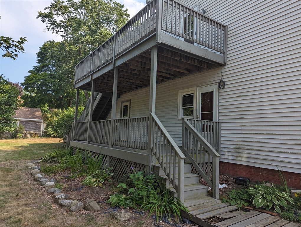 33 Merrill Street, Unit 3 Newburyport, MA 01950 - Photo 16 of 17 a view of a house with wooden deck