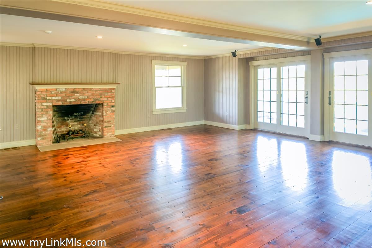 56 North Neck Road Edgartown, MA 02539 - Photo 13 of 63 a view of an empty room with window and fire place