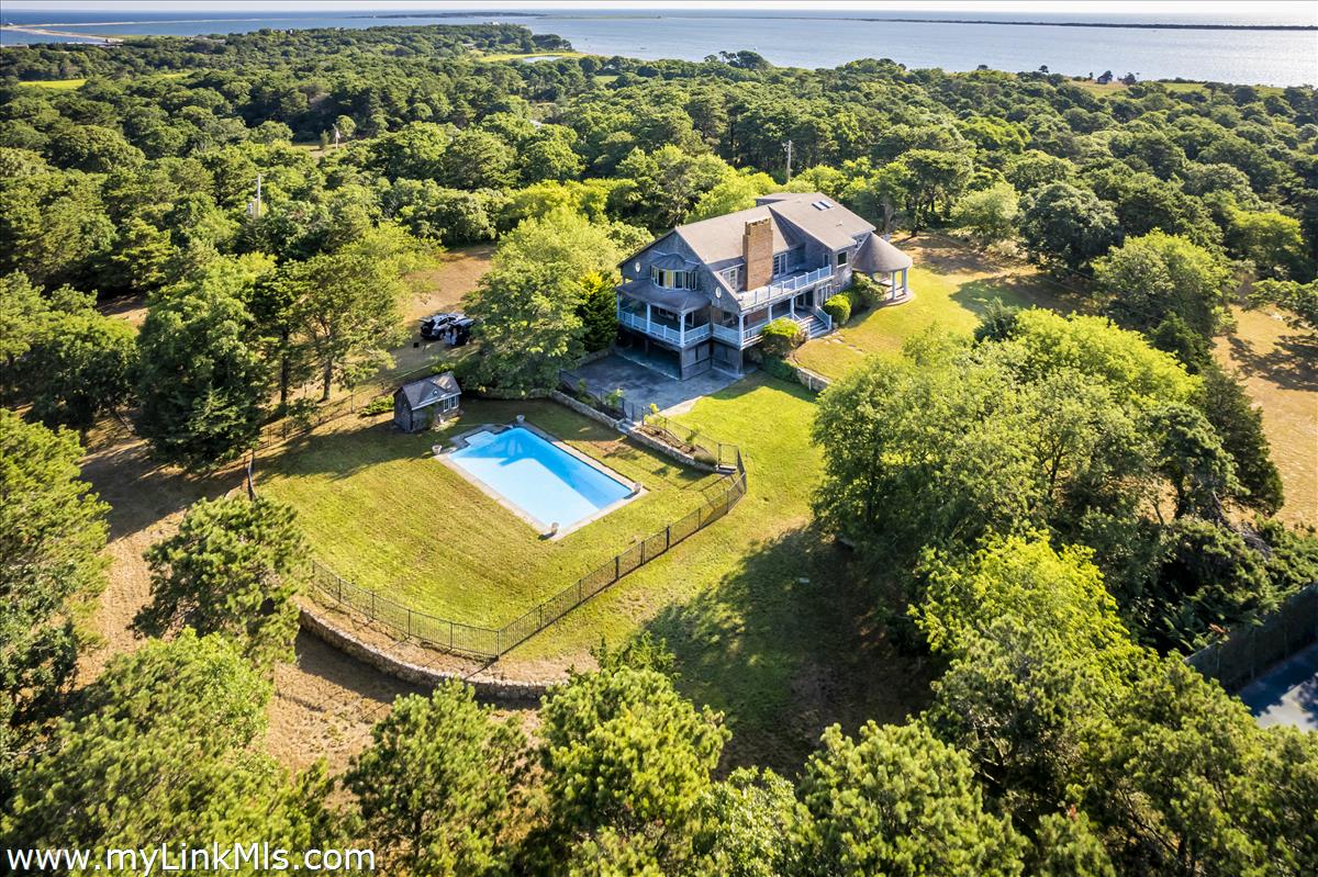 56 North Neck Road Edgartown, MA 02539 - Photo 2 of 63 an aerial view of residential houses with outdoor space and trees
