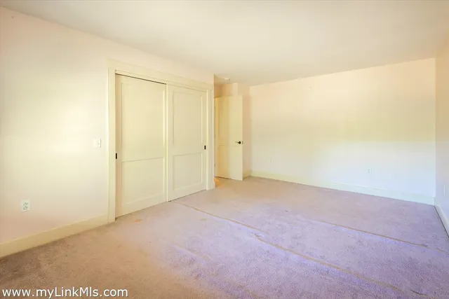 a bathroom with a granite countertop sink mirror and a shower