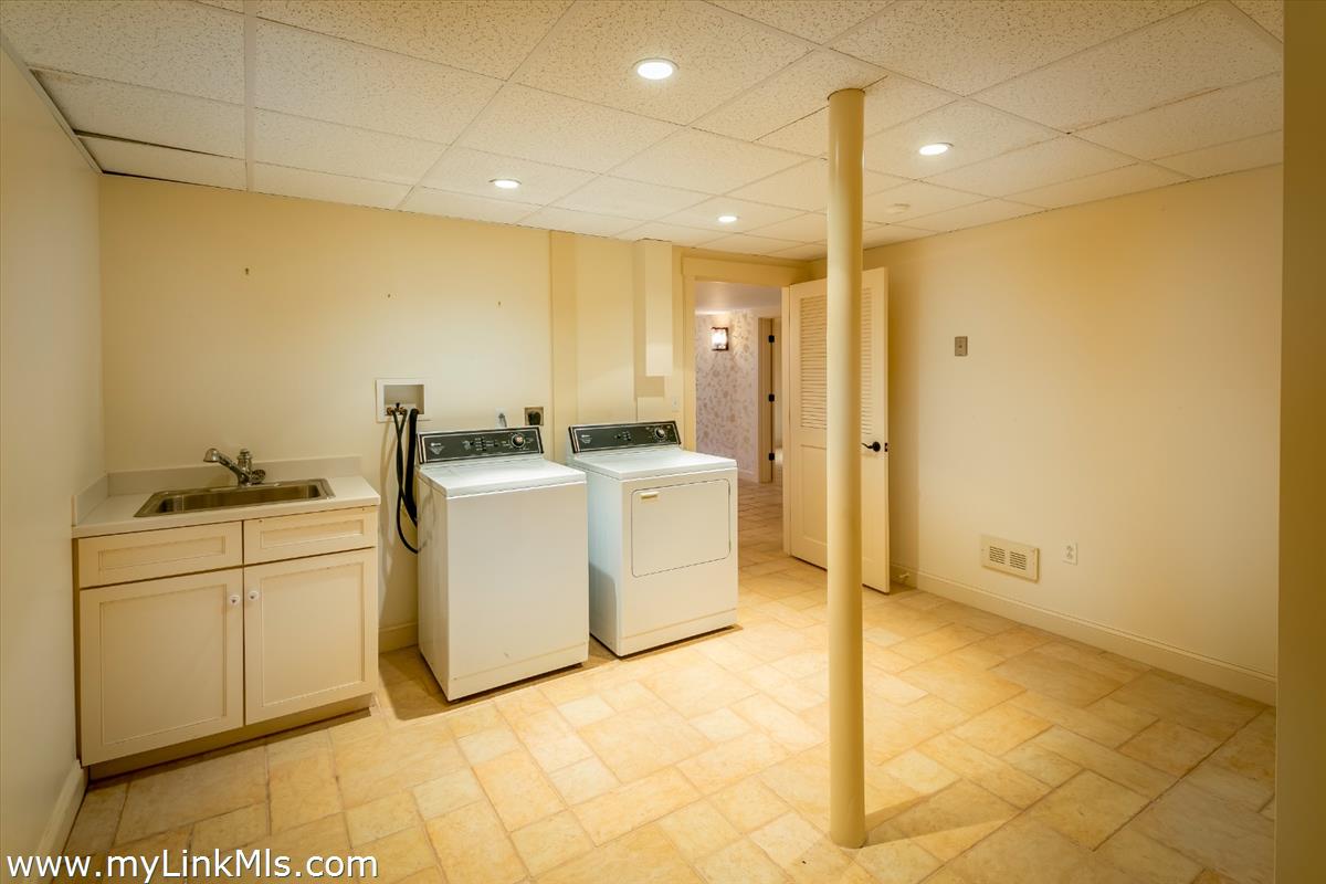 56 North Neck Road Edgartown, MA 02539 - Photo 27 of 63 a utility room with dryer and washer