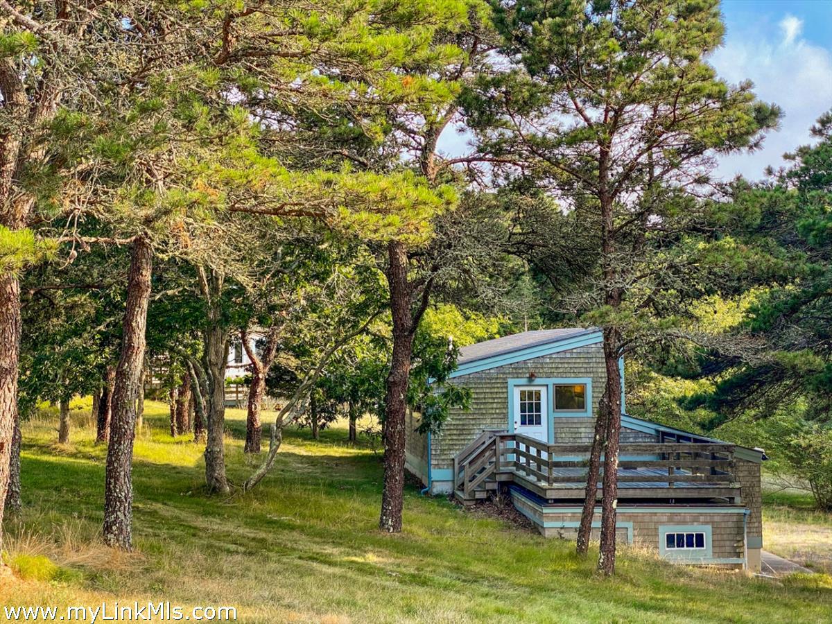 56 North Neck Road Edgartown, MA 02539 - Photo 32 of 63 a view of a house with a yard